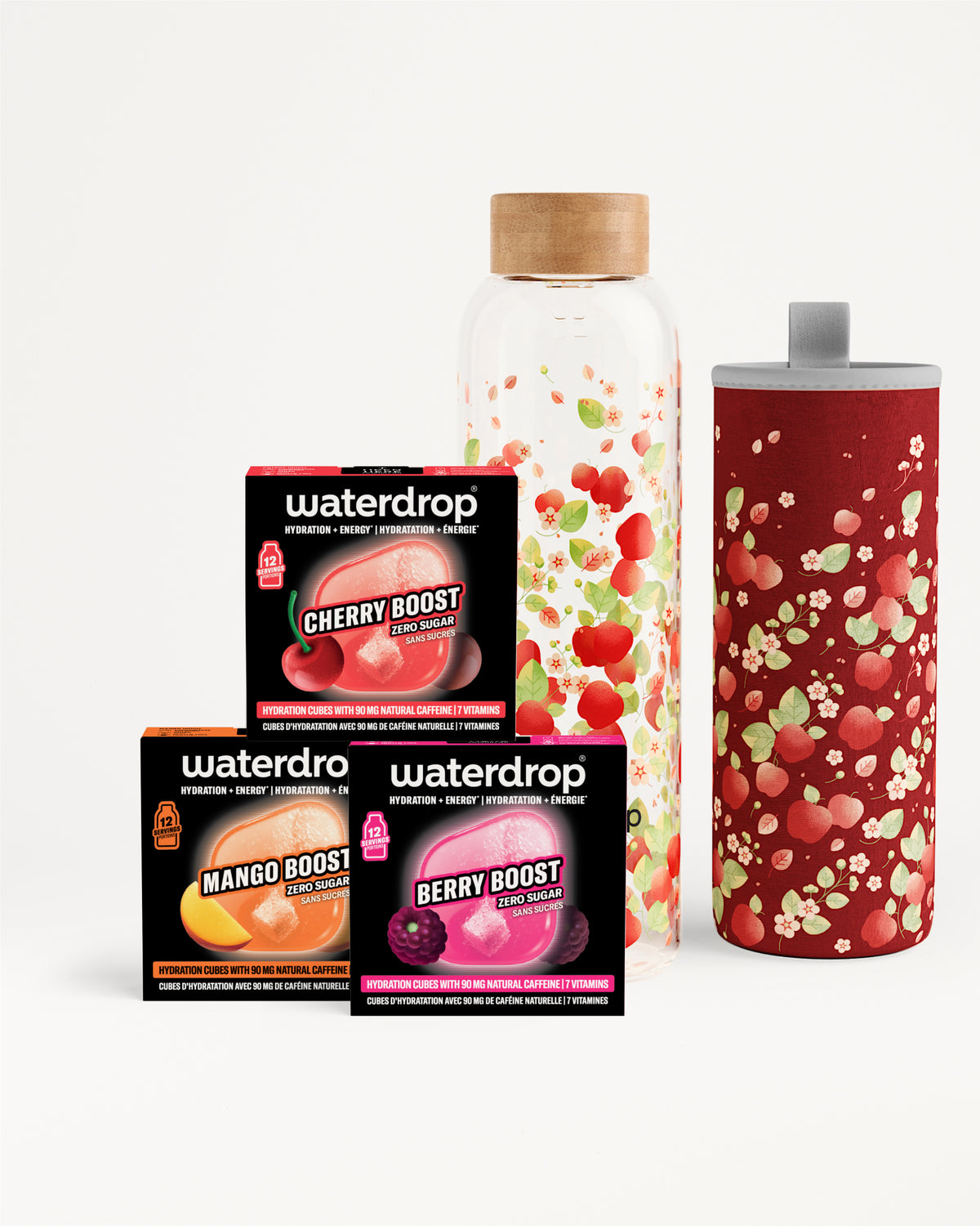 Assorted Waterdrop flavor boosters (Cherry Boost, Mango Boost, Berry Boost) with a glass bottle and a red speckled tumbler.