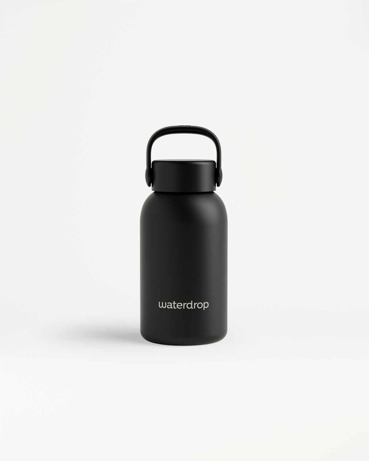 Black insulated bottle with a curved handle and matte finish on a light background.