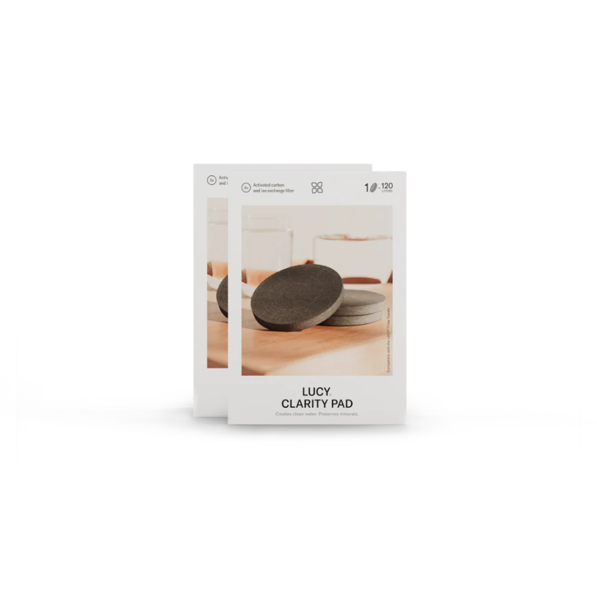 LUCY Clarity Pad stack, a patented filter for tap water, minimizing plastic waste by replacing up to 240 bottles with activated carbon fibers. Available in 1-, 3-, or 6-pack.