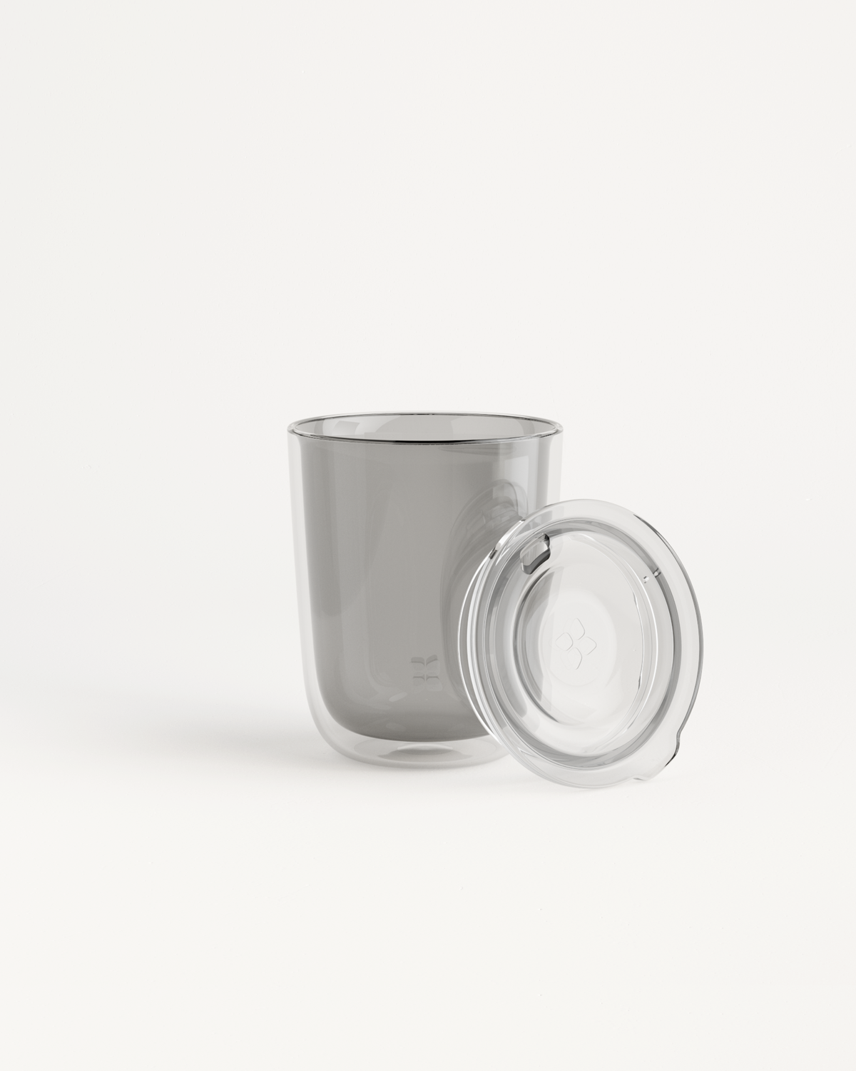 Glass Cup Set featuring a double-walled clear glass with a comfortable sip lid, ideal for both warm and cold beverages.