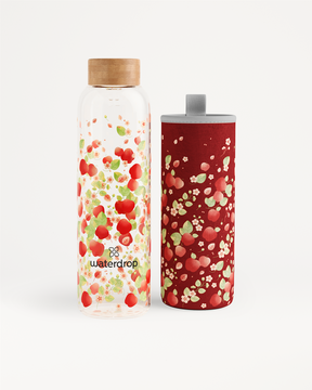 APPLE Edition Glass bottle with fruit pattern and matching red sleeve.