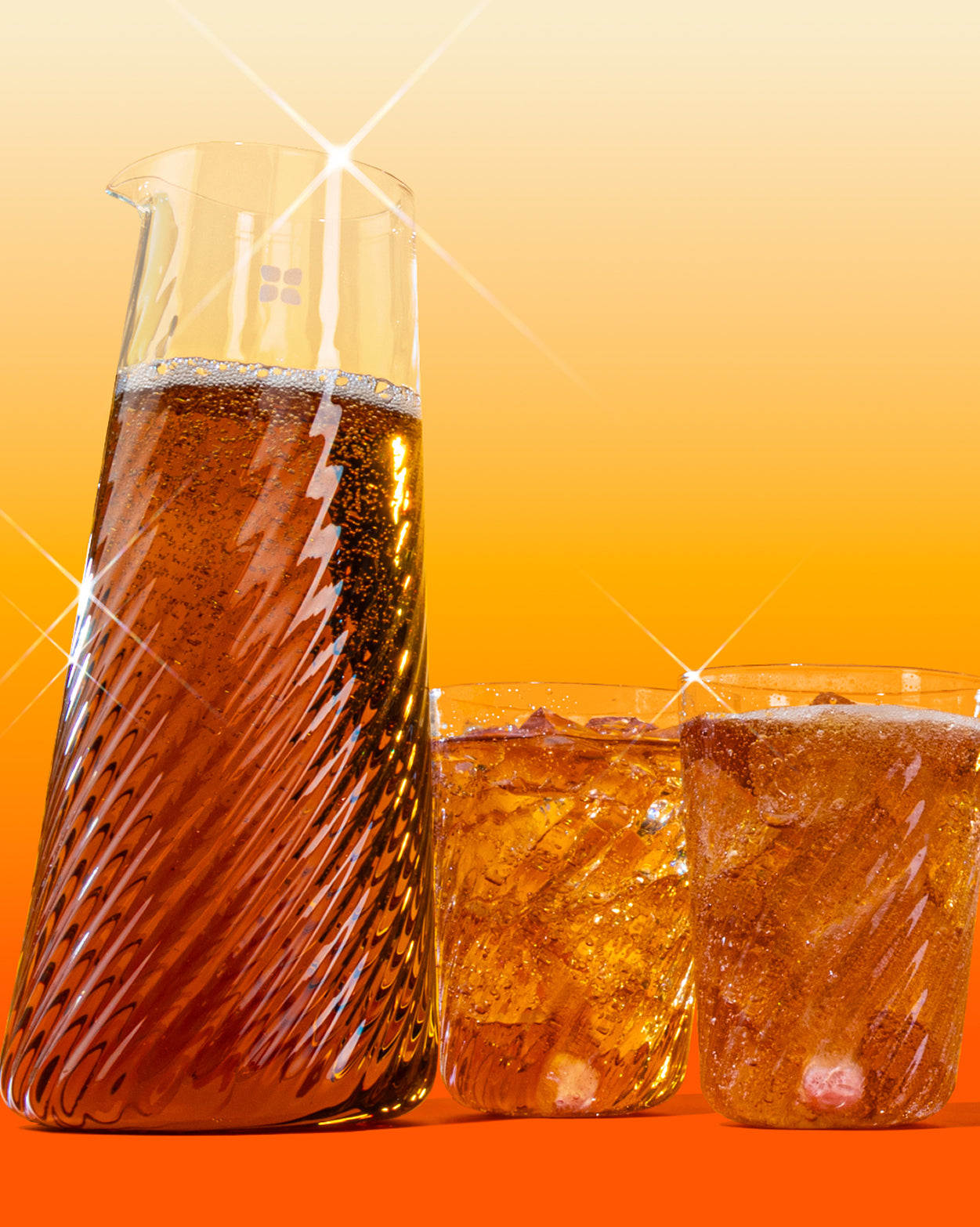 Rippled Carafe Set with fizzy drink in elegant glassware.