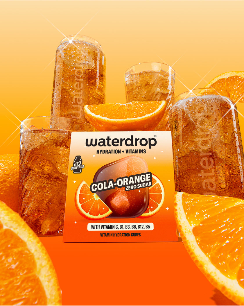 Rippled Carafe Set with Cola-Orange vitamin cubes.