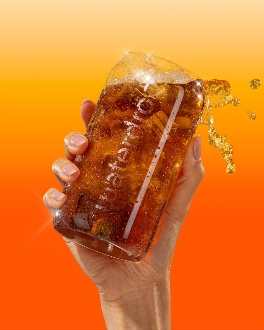 Rippled Carafe Set with cola, ice splashing out.