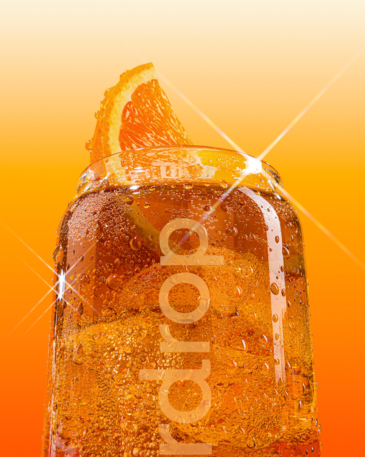 COLA Glass Can with fizzy orange drink and garnish.