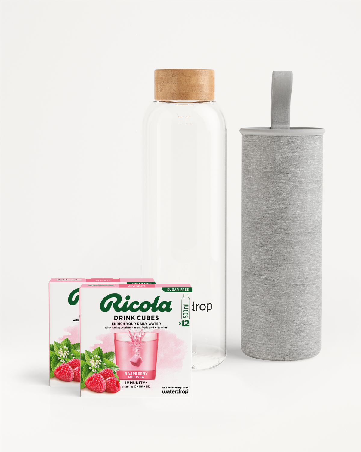 Ricola Bottle Set: Raspberry Melissa cubes with waterdrop bottle and sleeve.