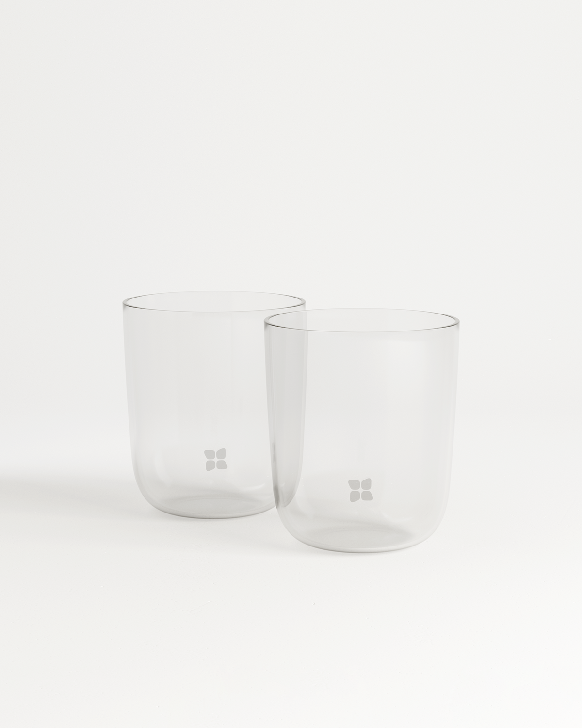 Two clear glasses with waterdrop® logo, made from borosilicate glass, displayed on a white background.