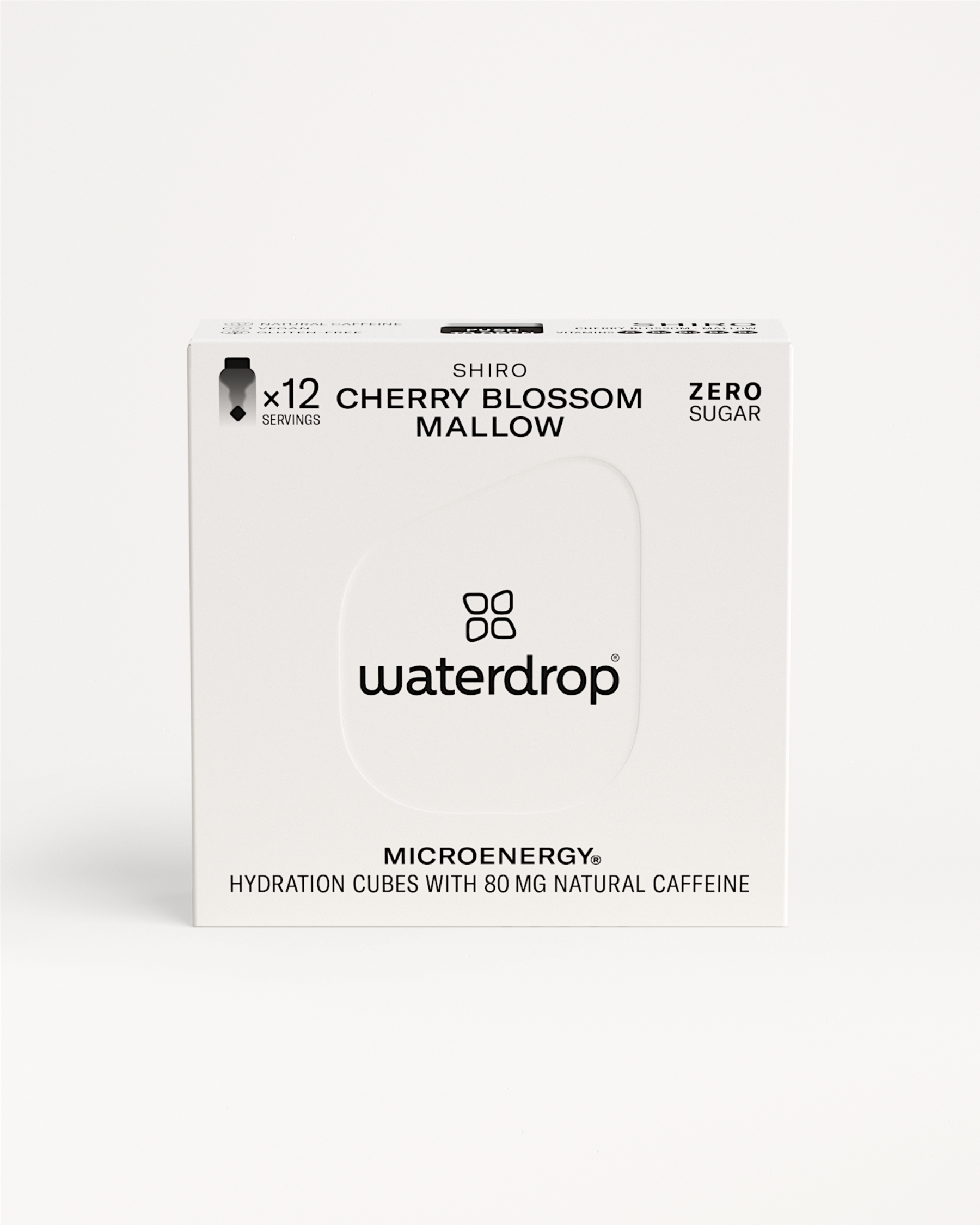 White box with black text featuring SHIRO and details about a cherry blossom, mallow, and ginseng blend with 80mg natural caffeine per serving.