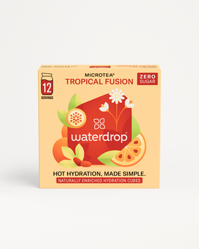 Box of TROPICAL FUSION Microtea featuring passion fruit, goji berries, and orange, offering an instant, no-brew, hot beverage experience.