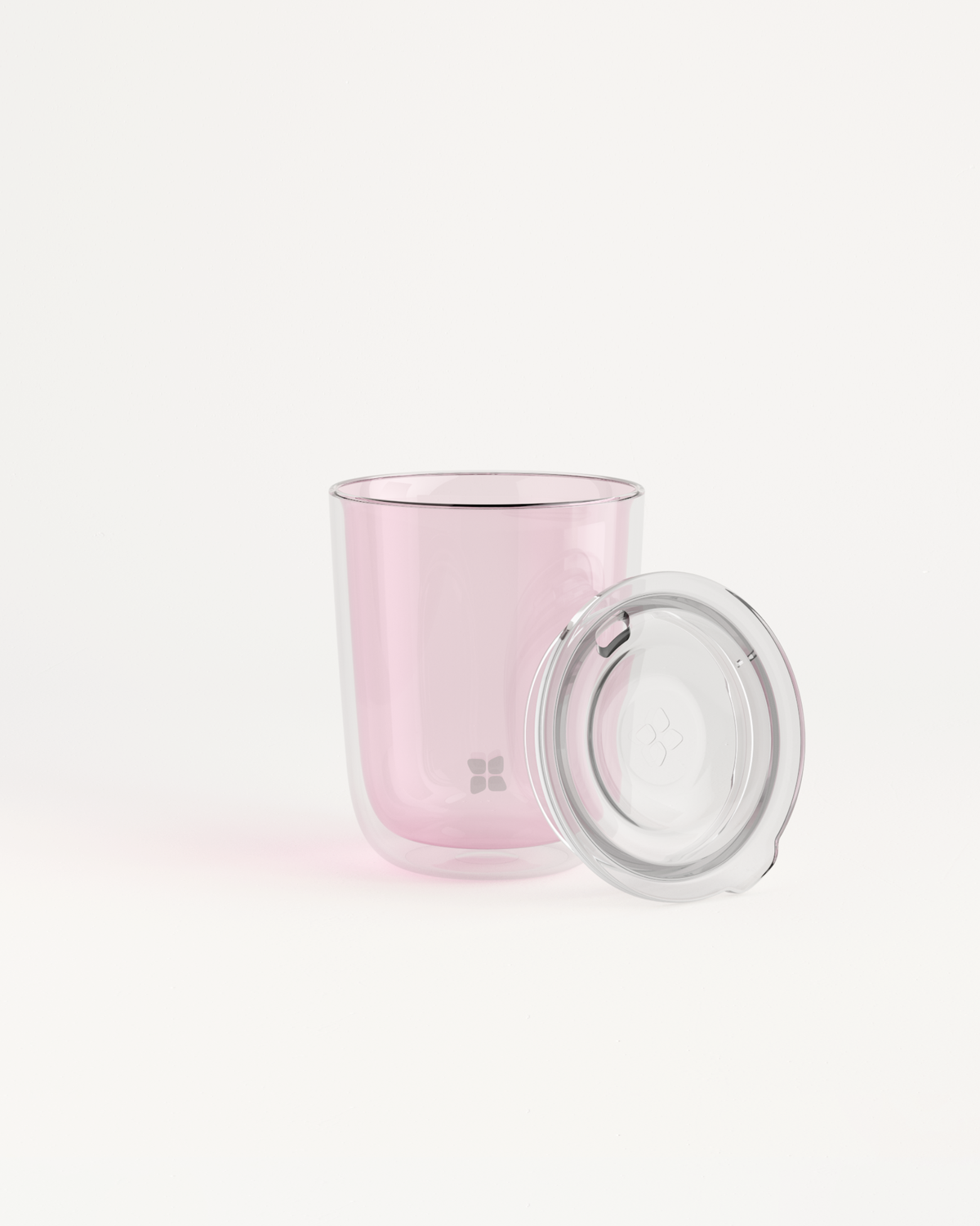 Glass Cup Set with double-walled design and Sip Lid, ideal for warm and cold drinks. The image shows a close-up of the cup and lid.