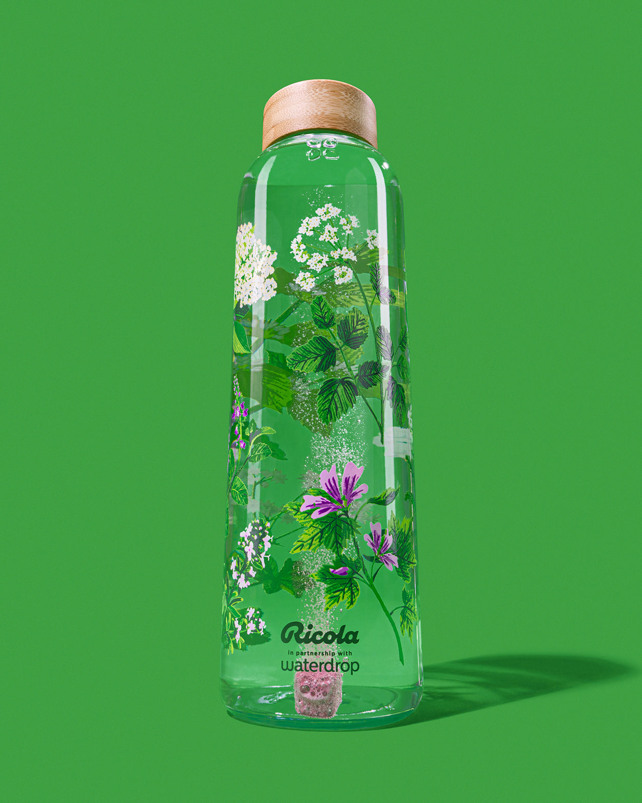 Ricola Edition Glass bottle with dissolving flavor cube.