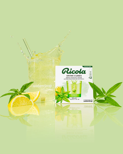 Verbena Citrus drink with Ricola cubes, lemon, and verbena leaves.