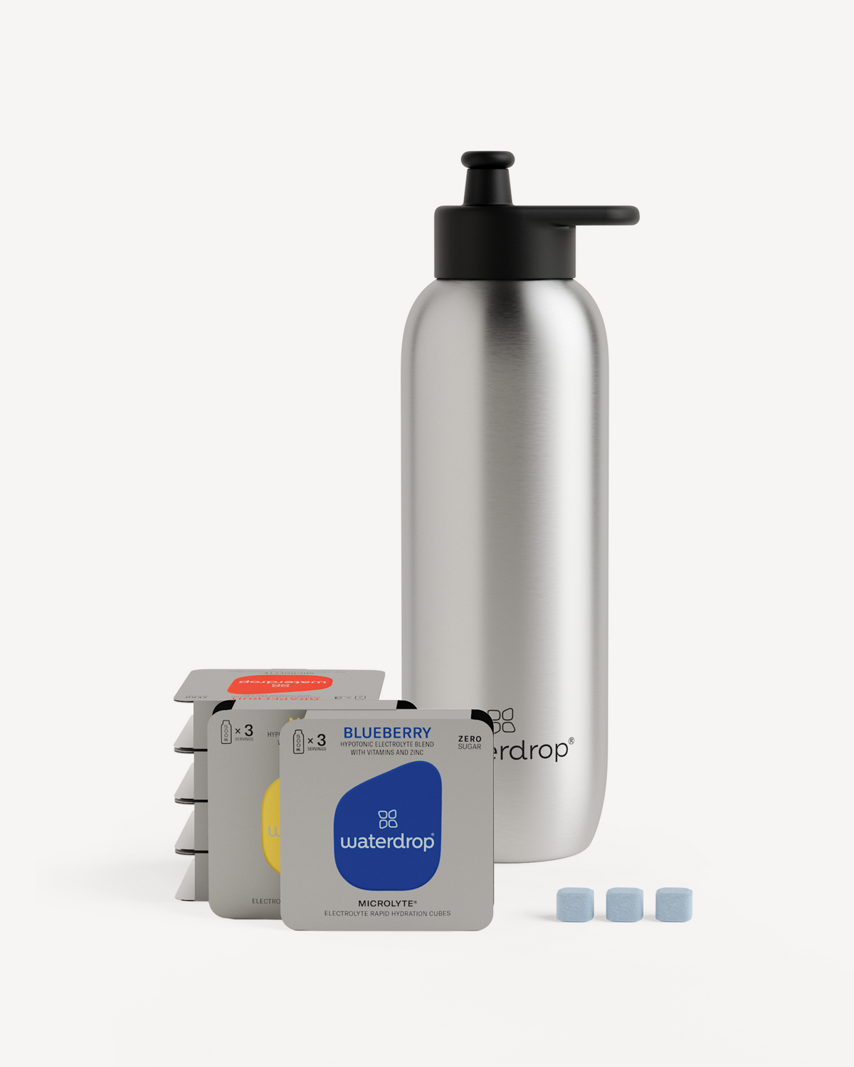 Starter Set Microlyte Ultralight Steel: Silver bottle with black cap, surrounded by blue and white tablets, and labeled boxes.