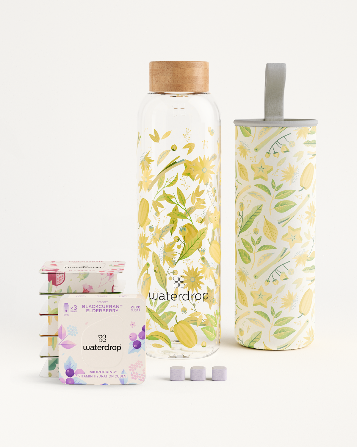 Starter Set Microdrink Glass: Includes a floral-designed glass bottle, elderberry flavor cubes, and other waterdrop® hydration essentials.