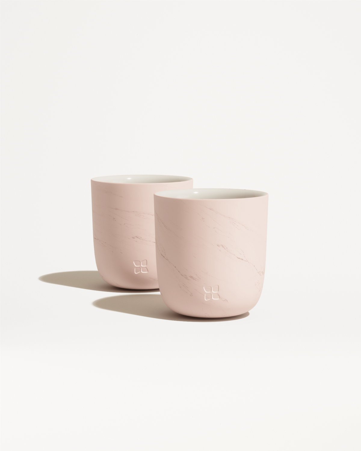 Marble Cups with embossed flower logo, double-walled porcelain design.