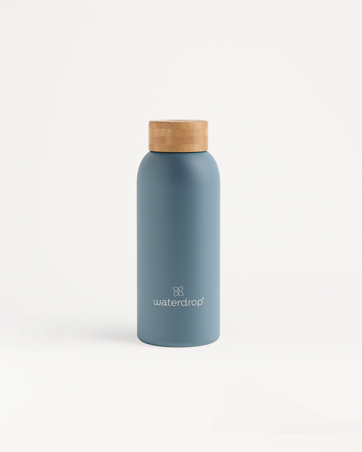 Thermo Steel blue bottle with wooden lid, double-walled stainless steel, keeps drinks cold for 24 hours or hot for 12 hours, available in 400ml, 600ml, and 1L.