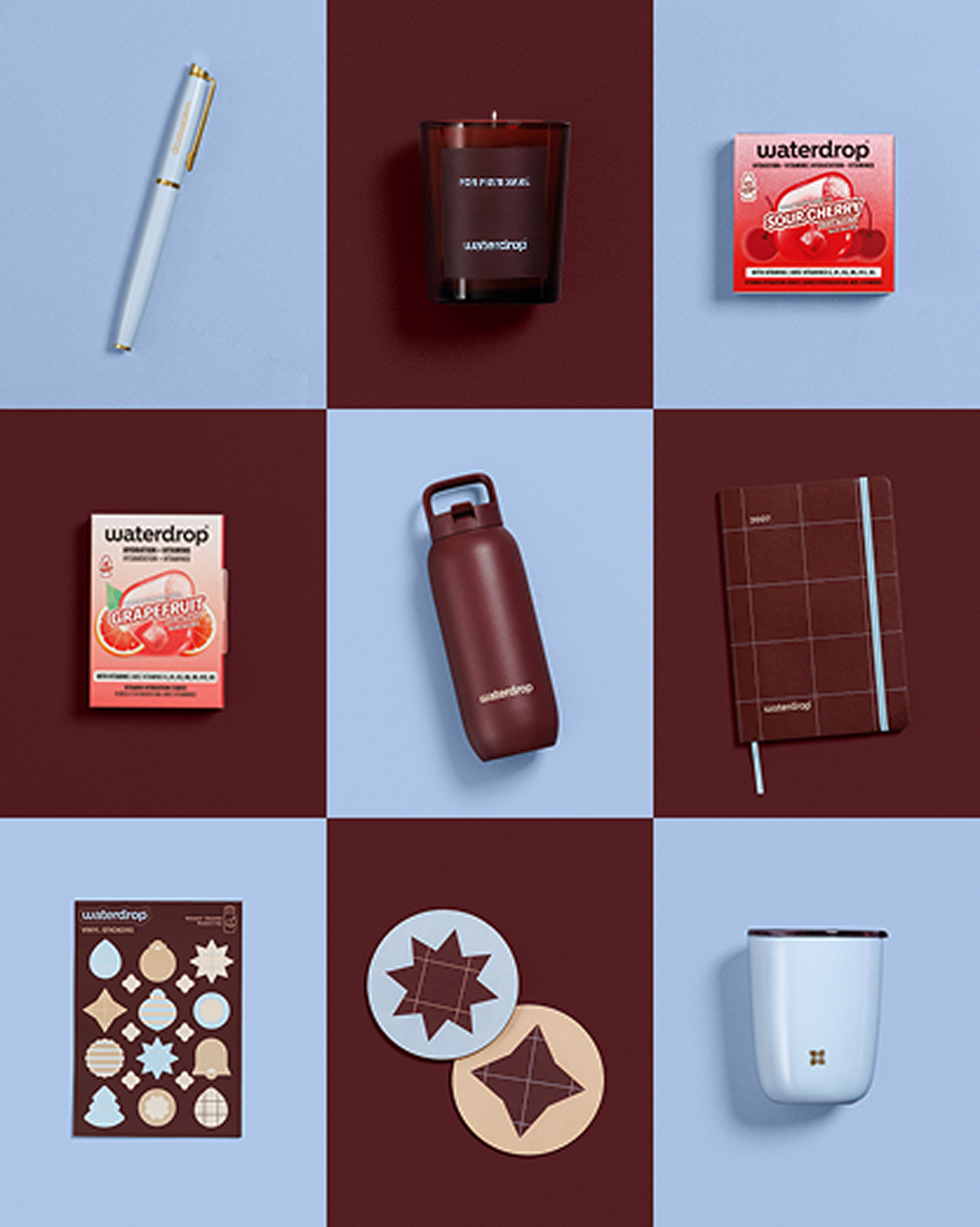 Nine-item grid of lifestyle products including a pen, burgundy bottle, red boxed items, plaid notebook, cookie cutters, star shapes, and a light blue mug.