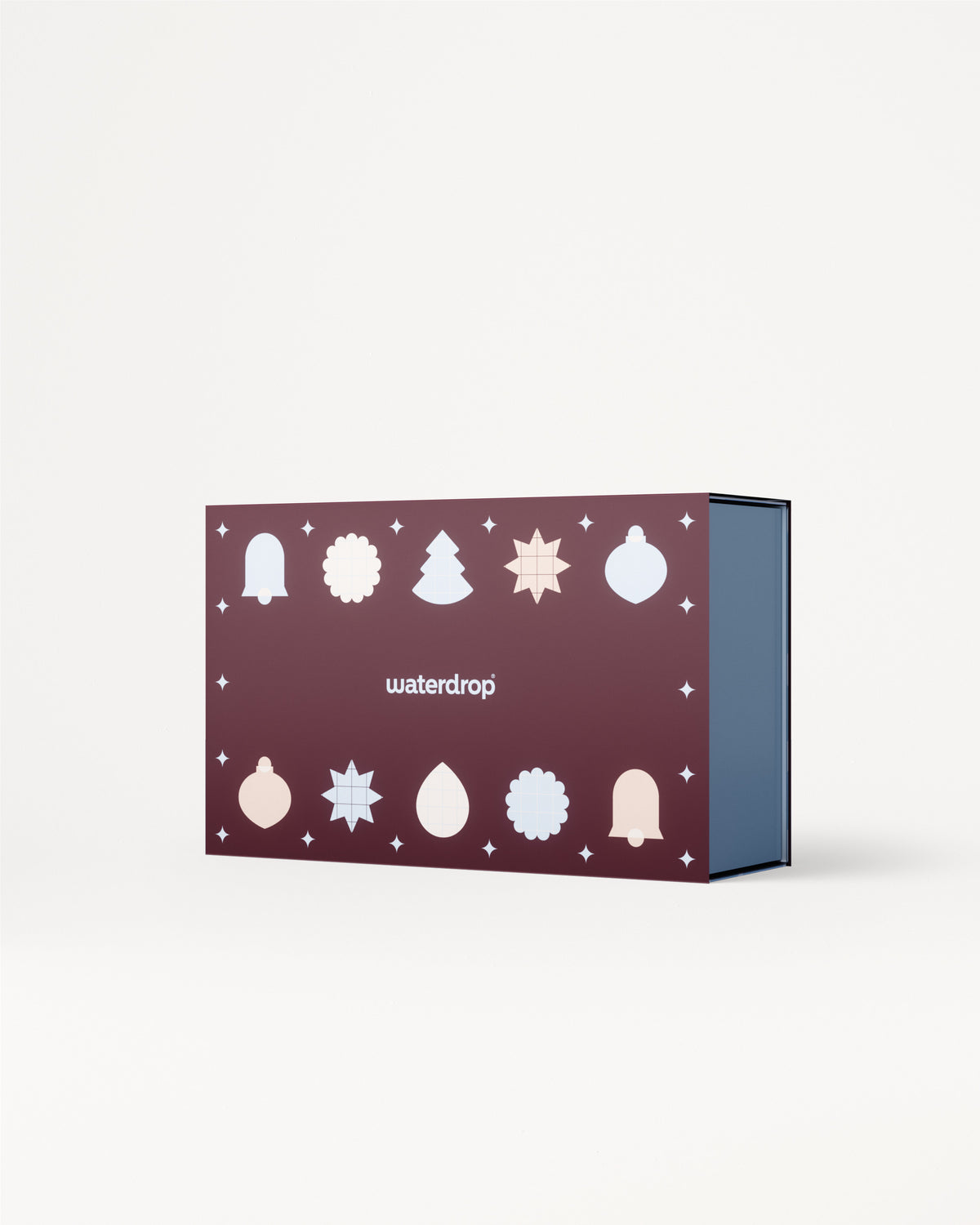 Purple gift box with white Christmas icons on the lid and blue interior.