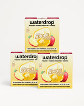 Three Waterdrop Apple hydration vitamin drops boxes stacked in a pyramid.