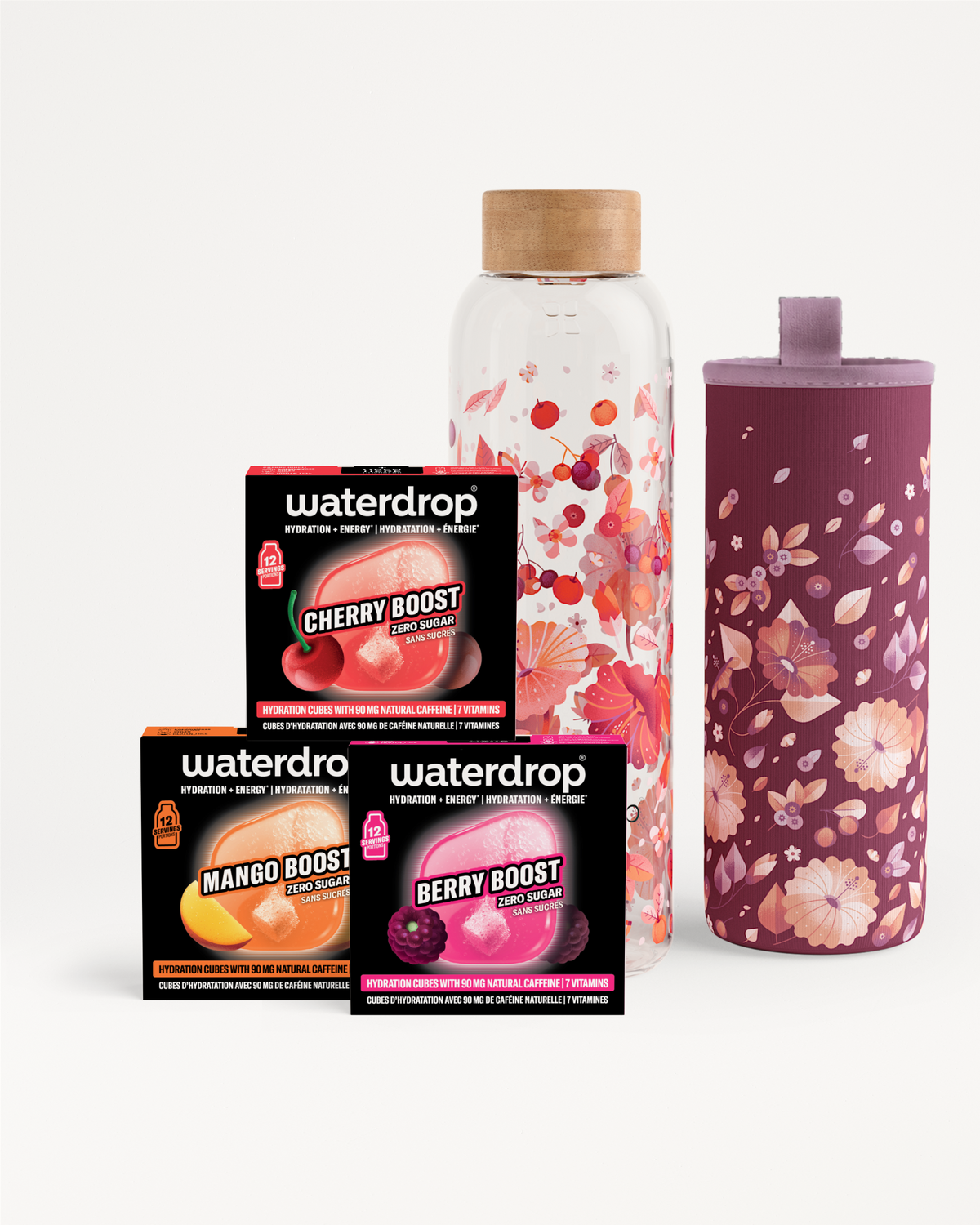 Assorted flavor booster sachets and bottles beside a floral-patterned tumbler.
