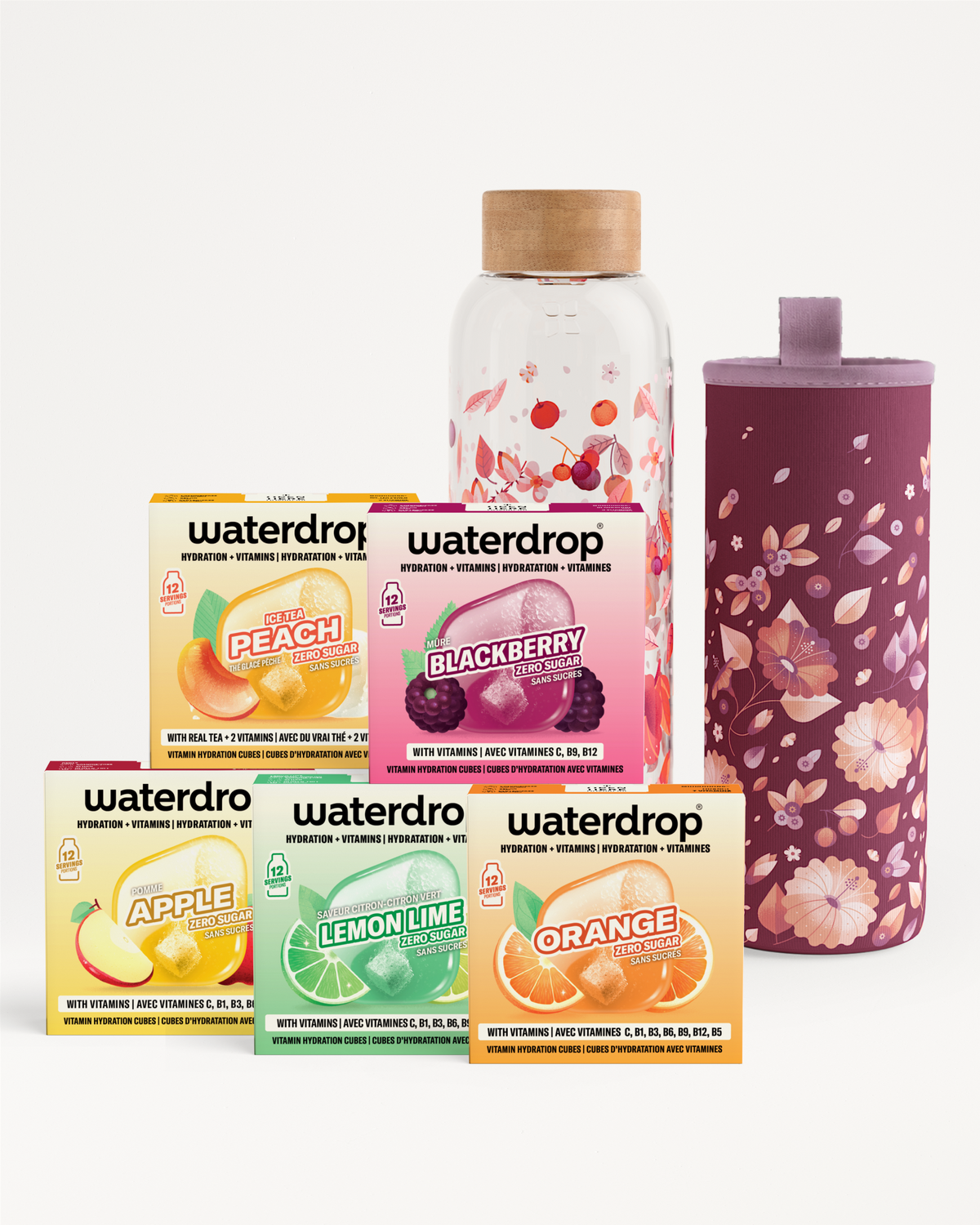 Assorted flavor concentrate boxes and a glass bottle with cork and a floral sleeve.