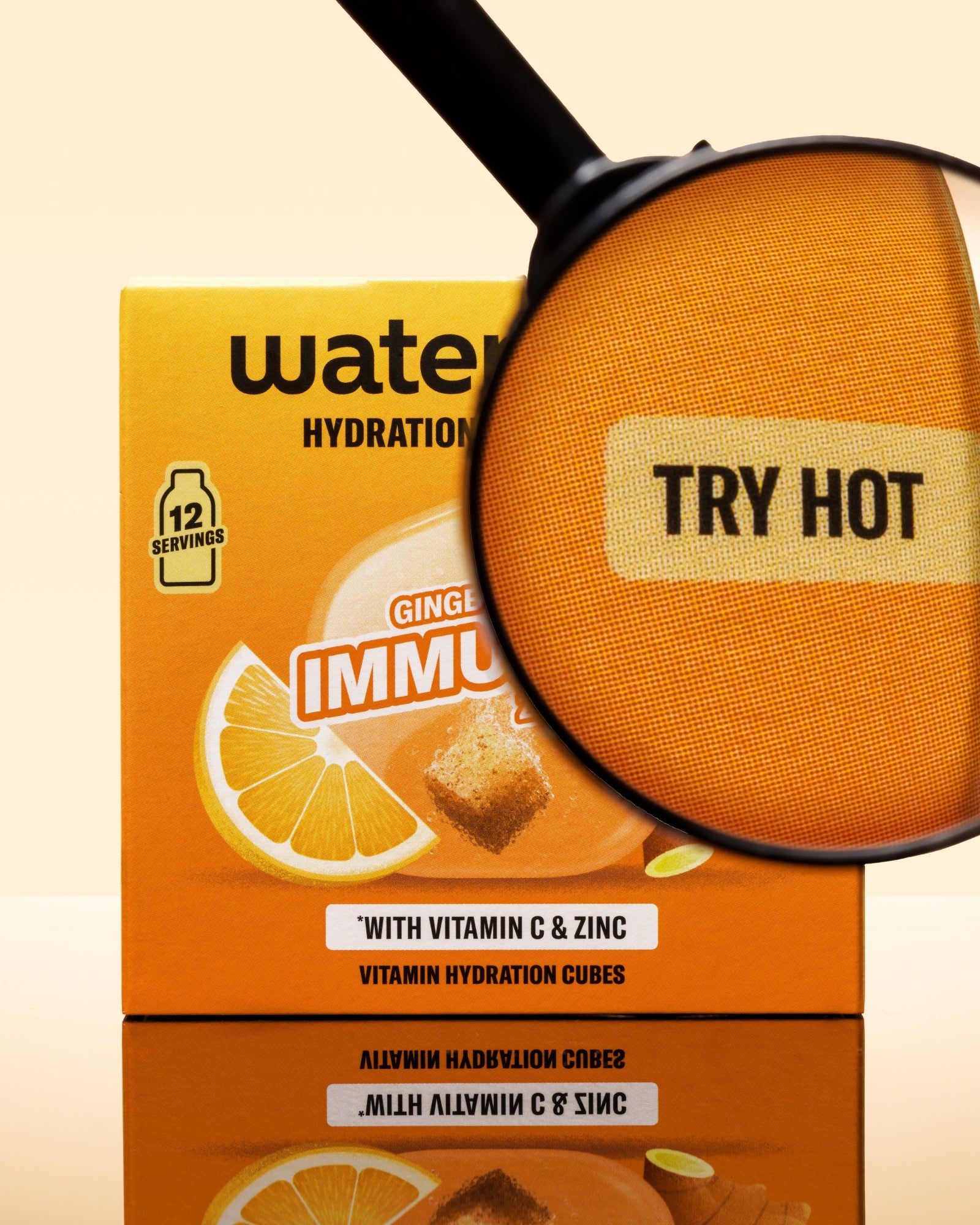 Orange hydration drink box with lemon imagery and a magnifying glass over the package.