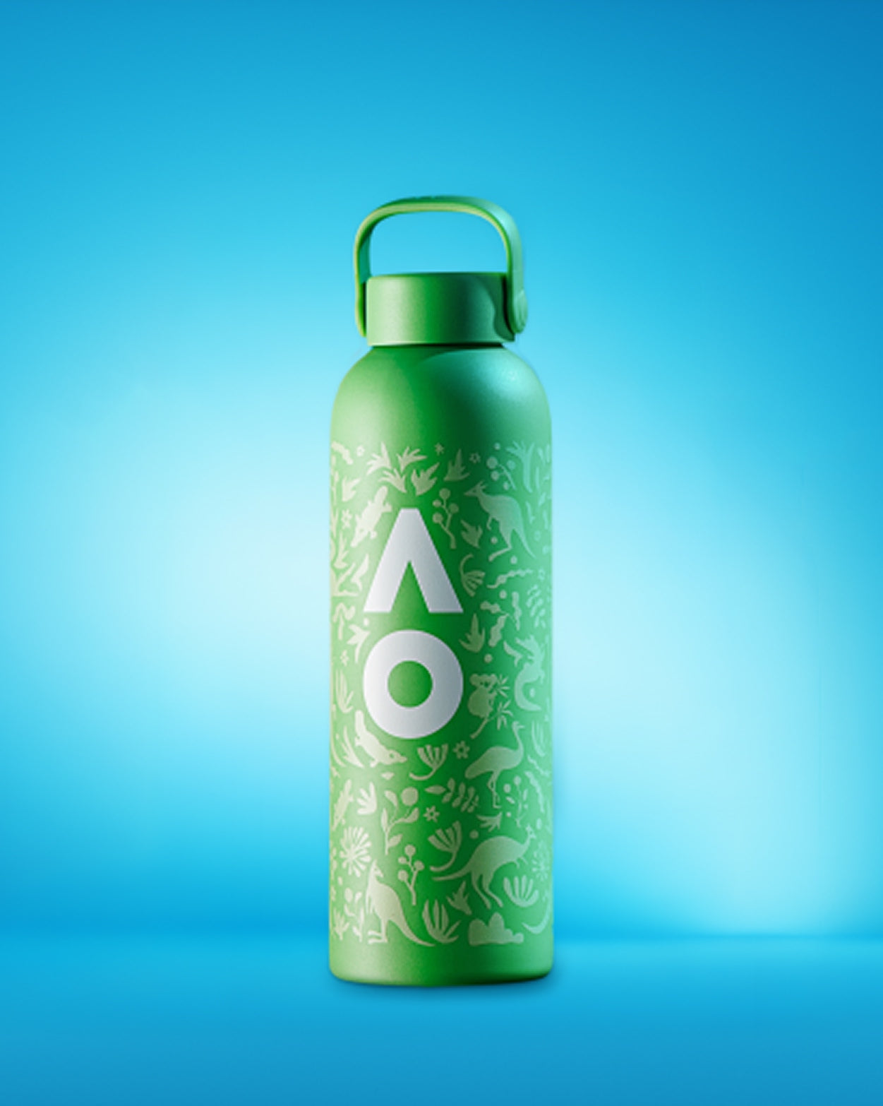 Green reusable water bottle with a leafy pattern and a handle-cap on a blue gradient background.