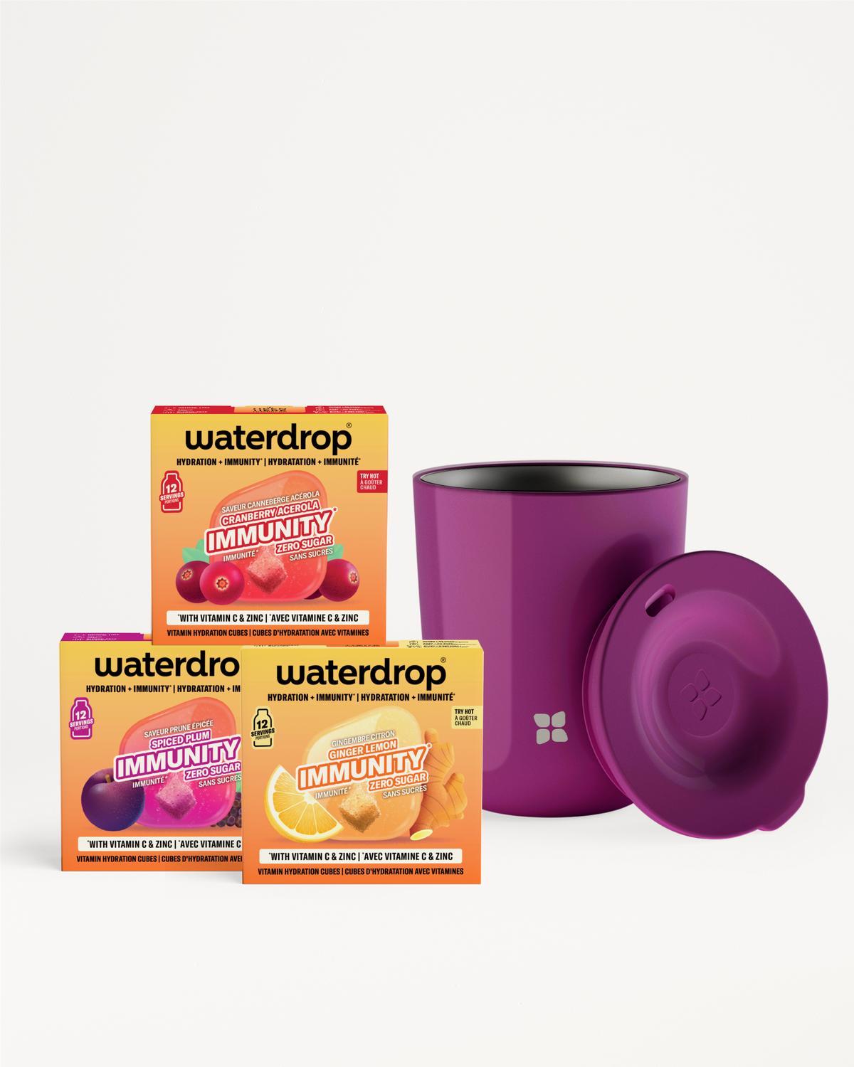 Three Waterdrop Immunity boxes with a purple insulated cup and lid.