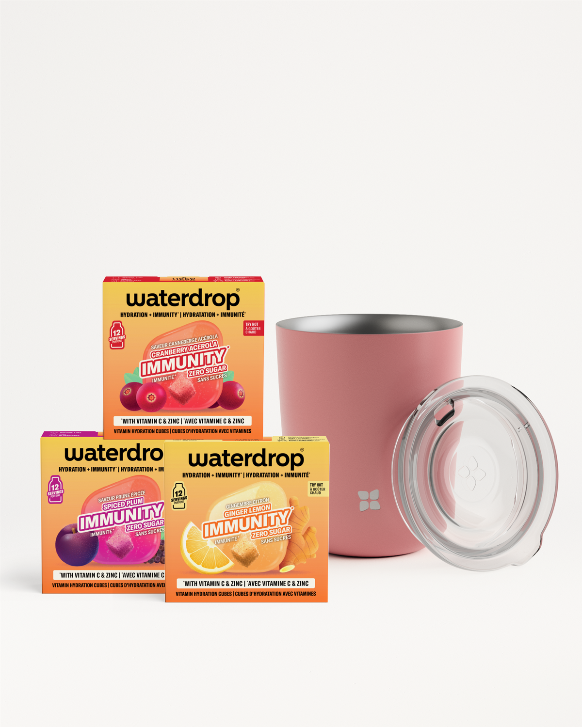 Assorted immune-boost beverage sachets arranged with a pink insulated tumbler and clear lid.