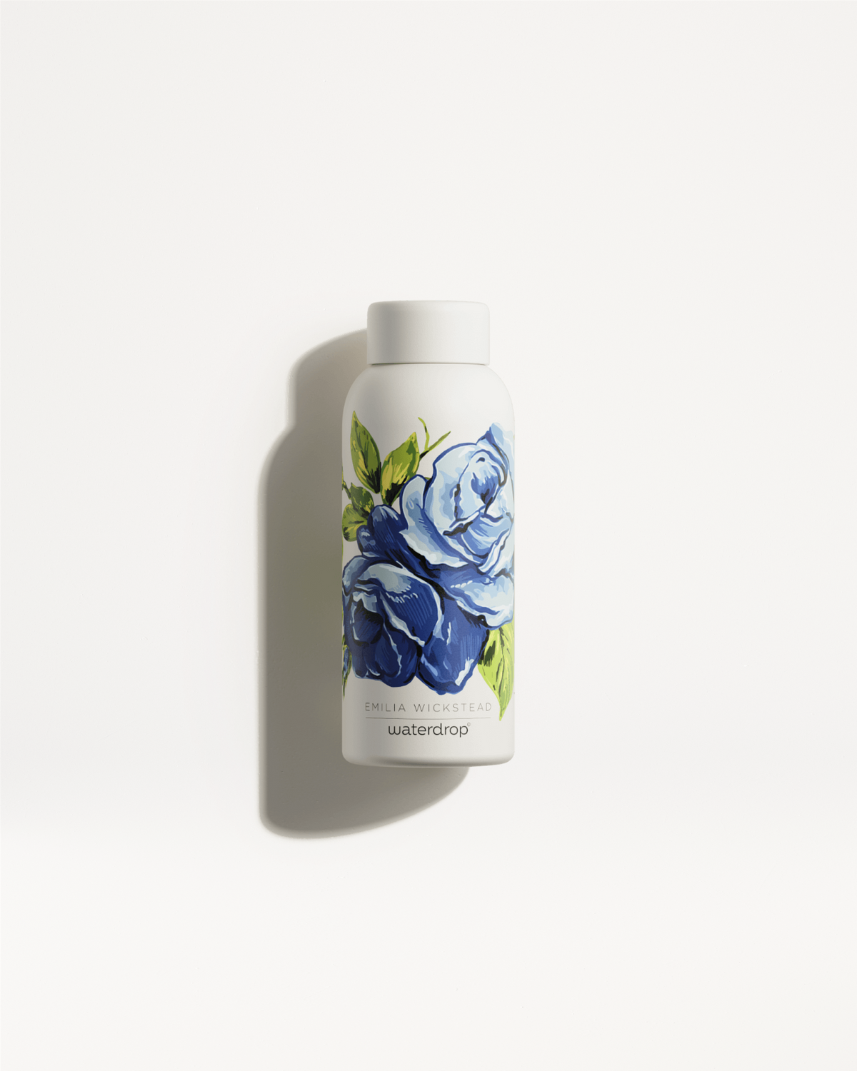 Emilia Wickstead Steel water bottle adorned with blue floral design, designed to keep drinks hot for 12h or cold for 24h.