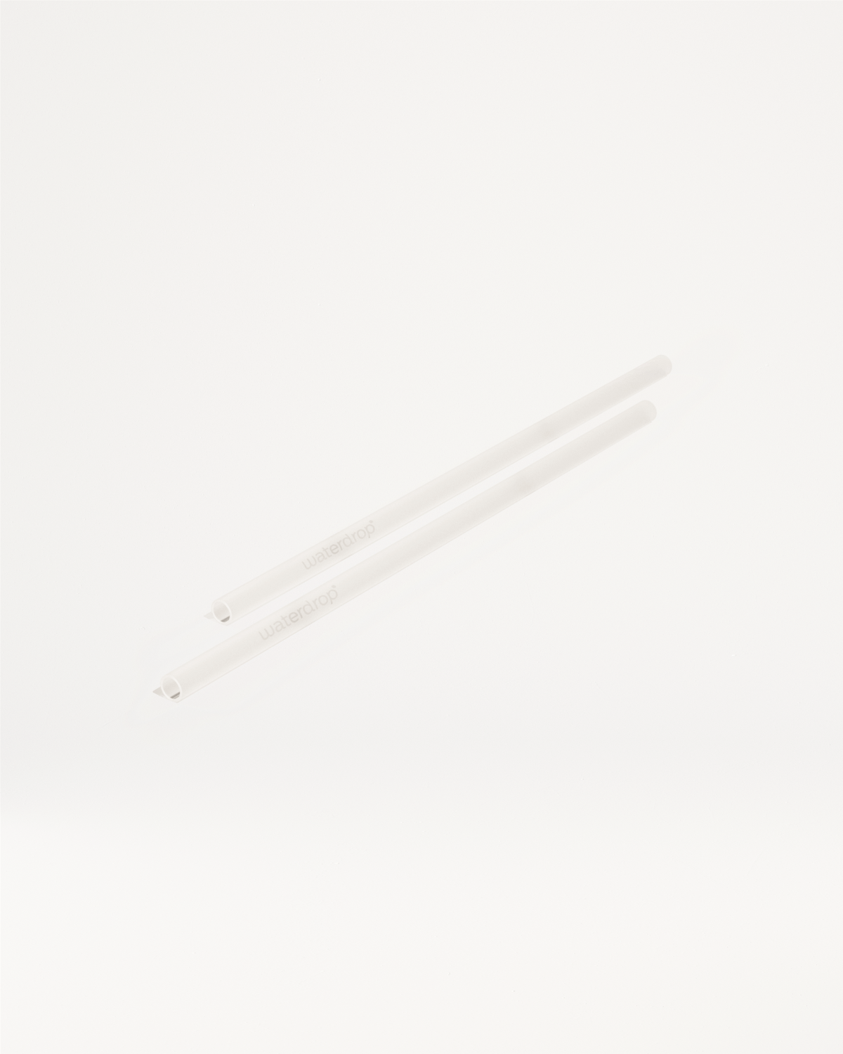 Glass straws made of durable borosilicate glass, shown as a pair, for sustainable drinking.