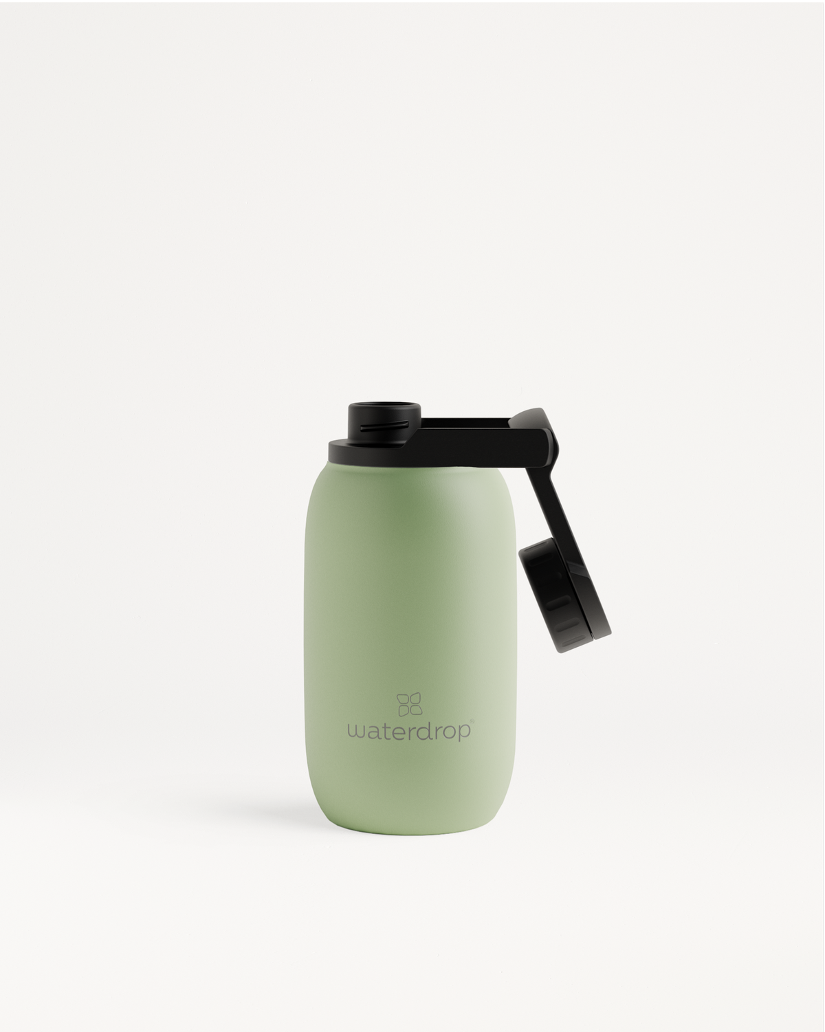 All-Purpose Thermo Swing Lid vacuum-insulated green water bottle with black lid, shown close-up for detailed view of cap and logo.