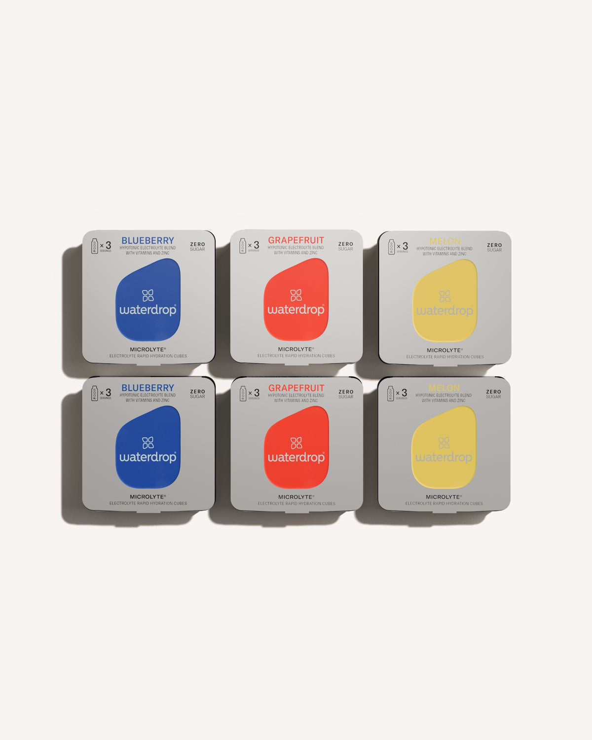 Microlyte Taster Pack featuring three flavors in square boxes: Blueberry, Grapefruit, and Melon, each with electrolytes, vitamins, and zinc.