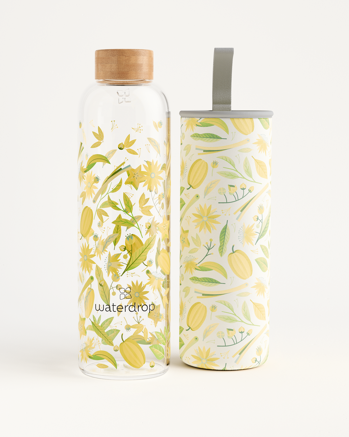 Edition Glass water bottle made of high-quality borosilicate glass, adorned with yellow flowers and leaves. Available in 400ml, 600ml, and 1L. Eco-friendly hydration solution.