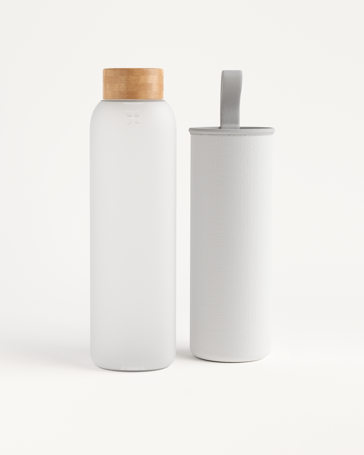 Frosted Glass bottle and white fabric container, highlighting the durable borosilicate glass for lasting use, suitable for home and on-the-go hydration.