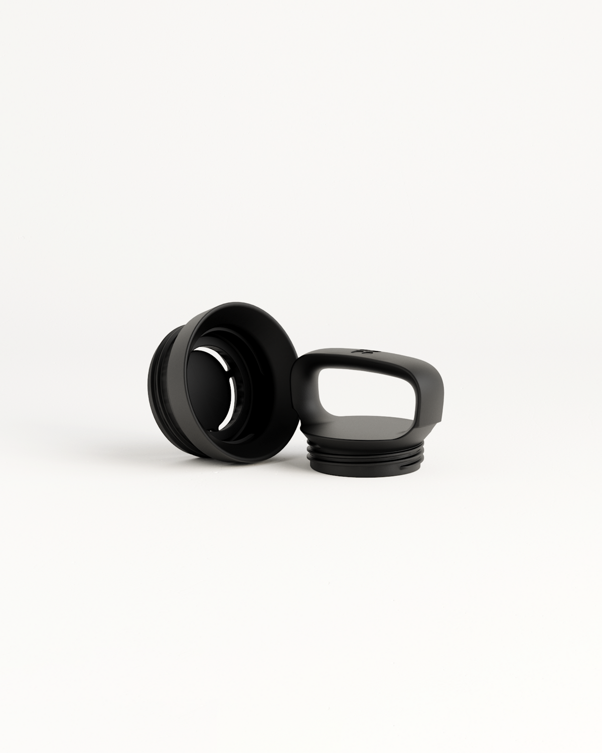 Close-up of Loop Lid for All-Purpose Bottle, featuring a black cap with a ring handle and wide drink opening, ideal for hot beverages.