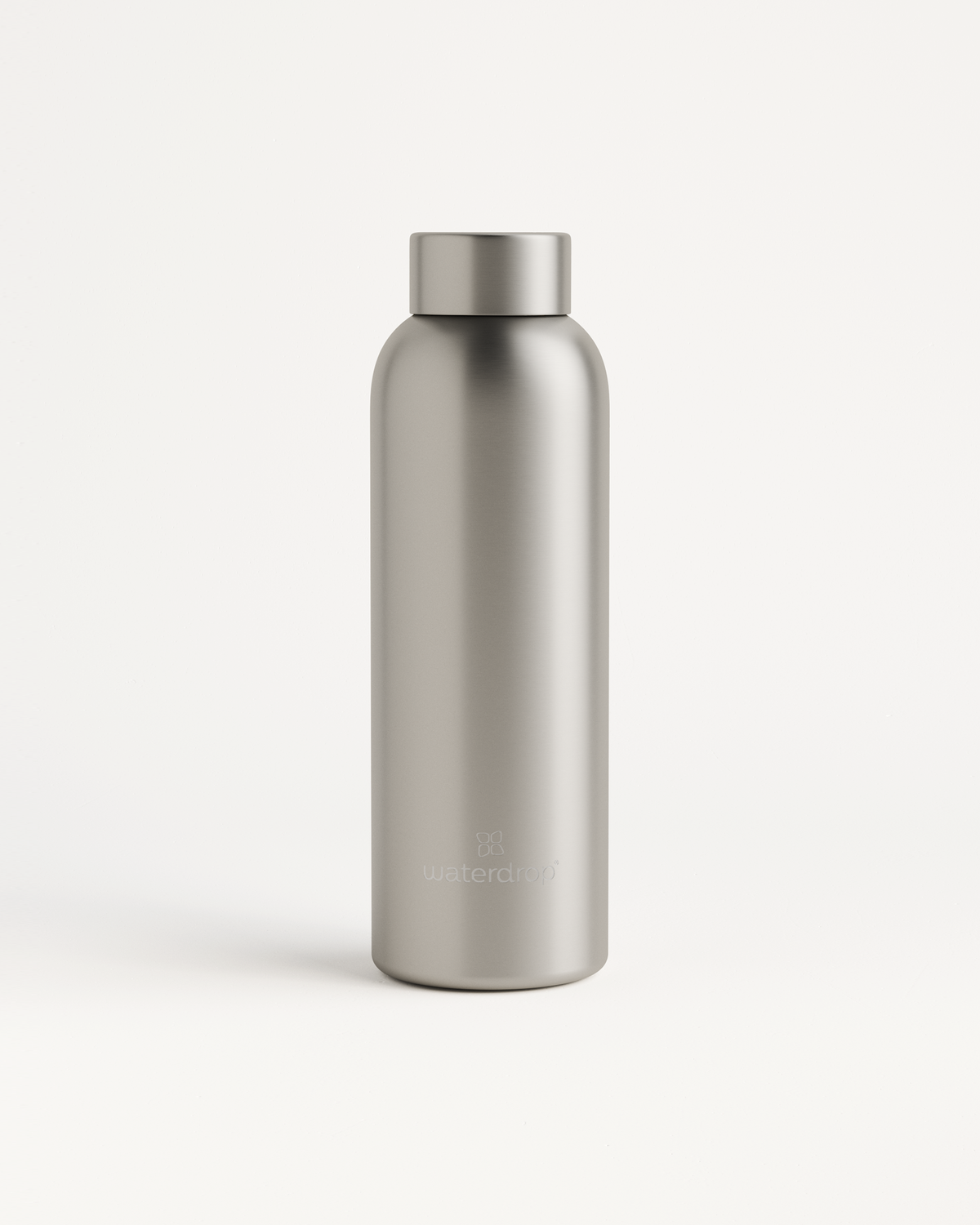 Silver Metal Thermo Steel bottle with a cap, featuring a brushed metal look and double-walled design for keeping drinks hot or cold. 600ml capacity.