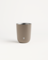 Close-up of a double-walled stainless steel cup, heat-resistant for hot and cold drinks.