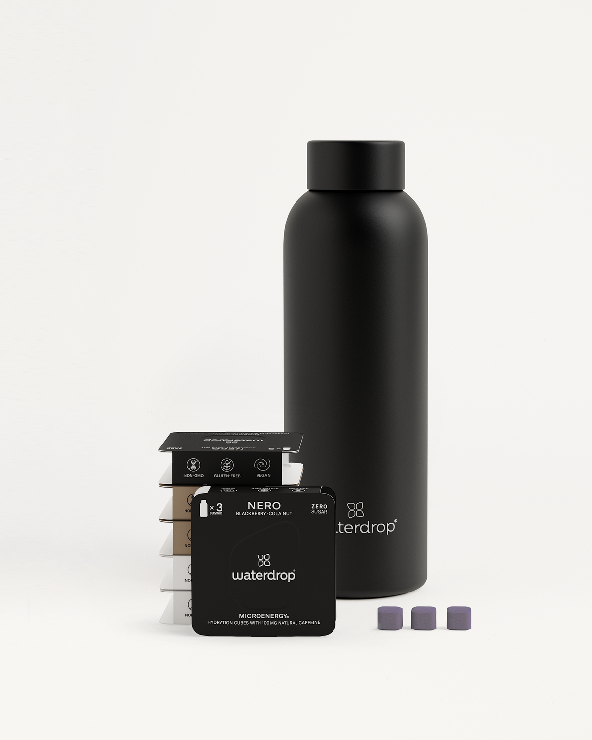 Starter Set Microenergy Thermo Steel: Black bottle and stack of black objects with white text, designed to keep drinks cold for 24 hours or warm for 12 hours.