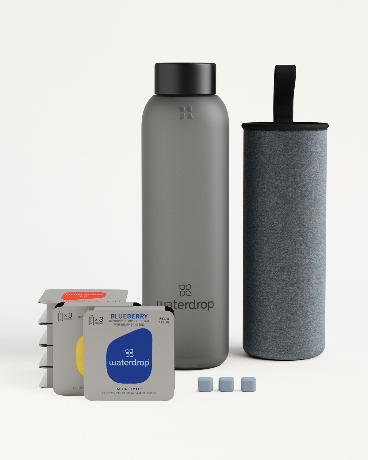 Starter Set Microlyte Glass includes a grey water bottle and a grey case, ideal for sports with three Microlyte flavors for hydration.