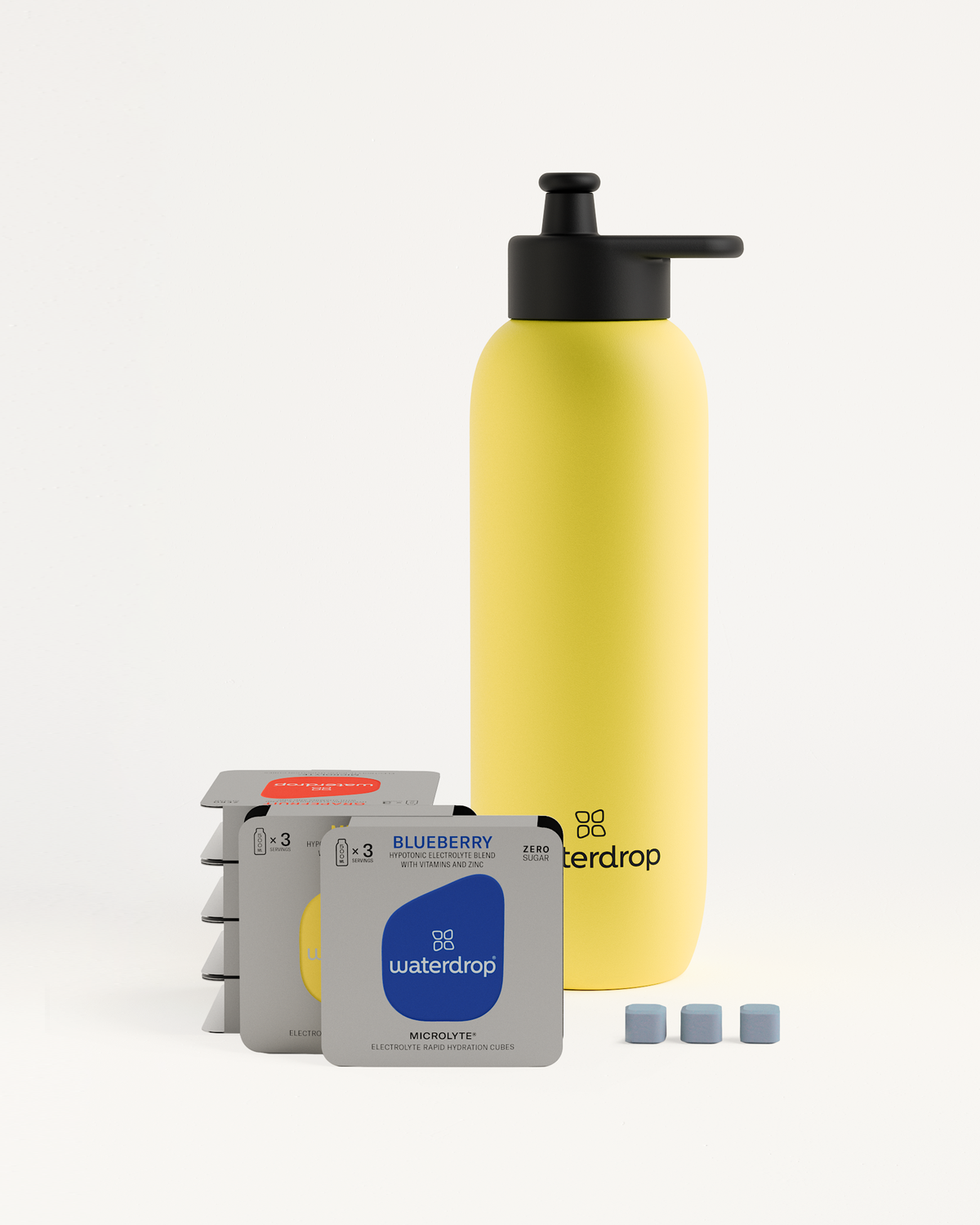 Starter Set Microlyte Ultralight Steel featuring a yellow bottle with a black lid, accompanied by a Microlyte Taster Pack of blue and white tablets.