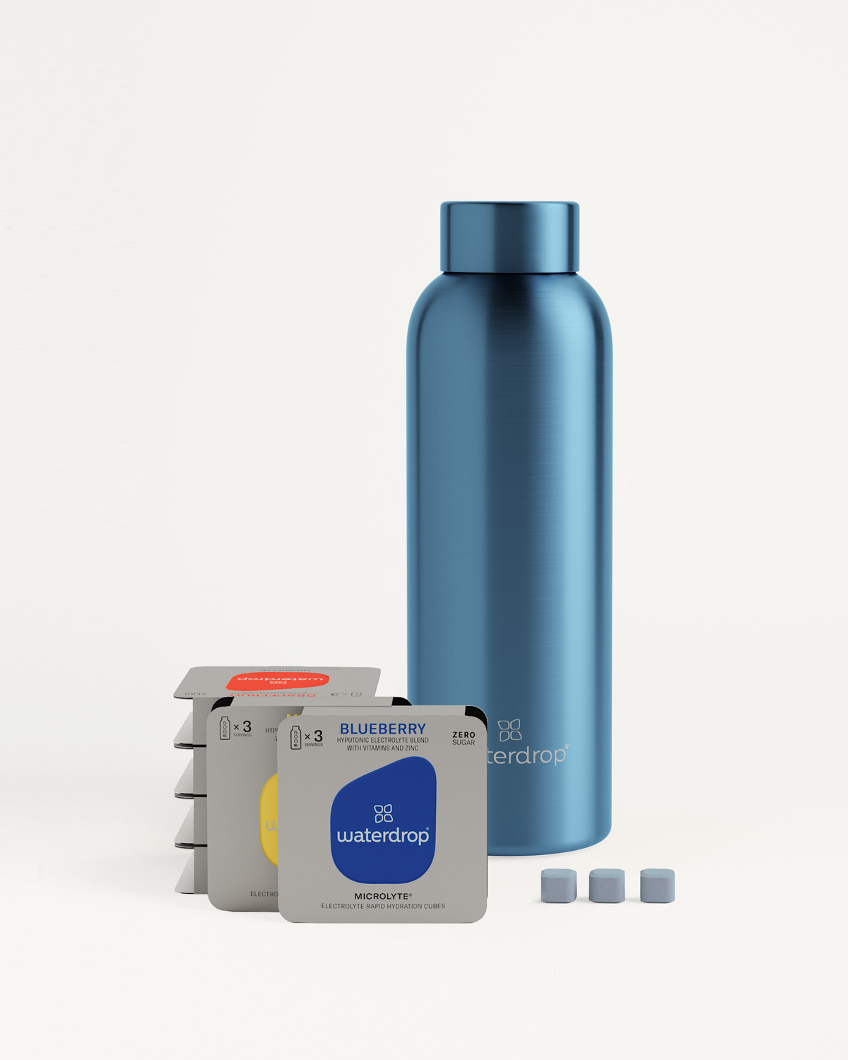 Starter Set Microlyte Thermo Steel with a blue bottle and three small packages of flavored Microlyte cubes: BLUEBERRY, GRAPEFRUIT, and MELON.