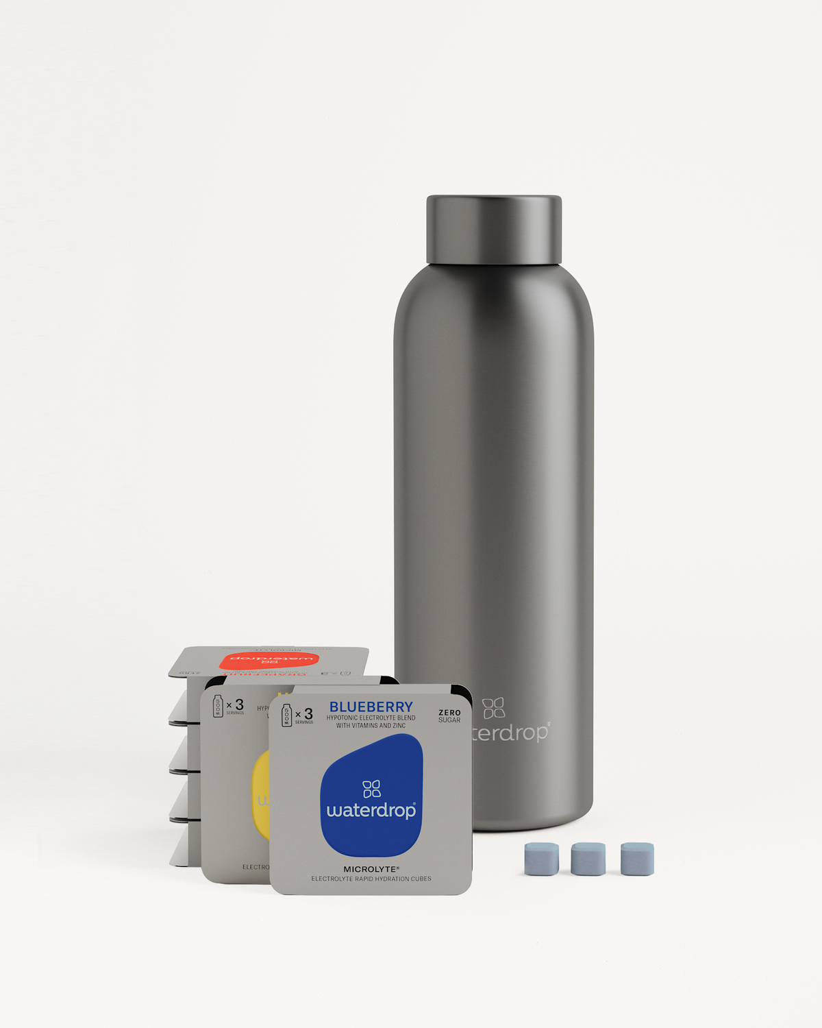 Starter Set Microlyte Thermo Steel featuring a Thermo Steel Bottle and small boxes of Microlyte flavored cubes: BLUEBERRY, GRAPEFRUIT, and MELON.