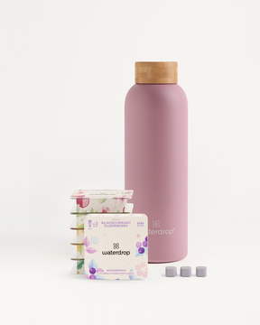 Starter Set Microdrink Thermo Steel: includes a pink bottle with a cork top and a pack of elderberry flavoring water drops.