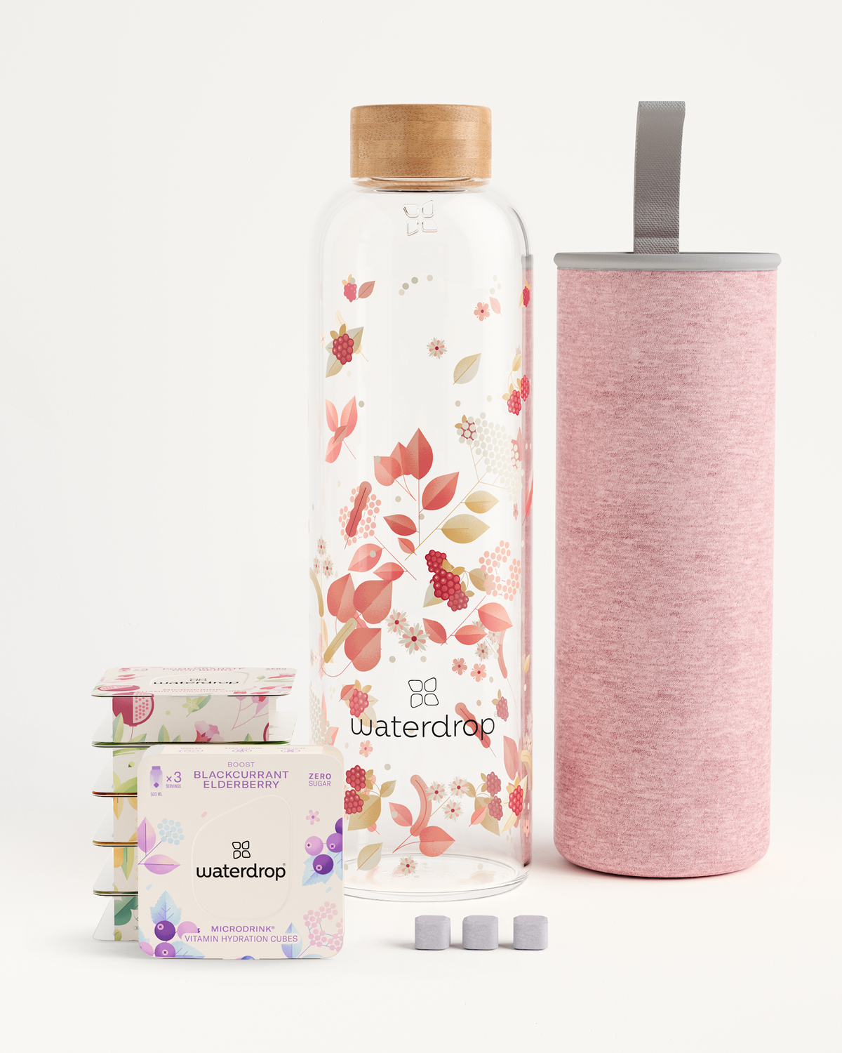 Starter Set Microdrink Glass featuring a patterned glass bottle and a pink container, ideal for sampling six Microdrink flavors in compact 3-packs.