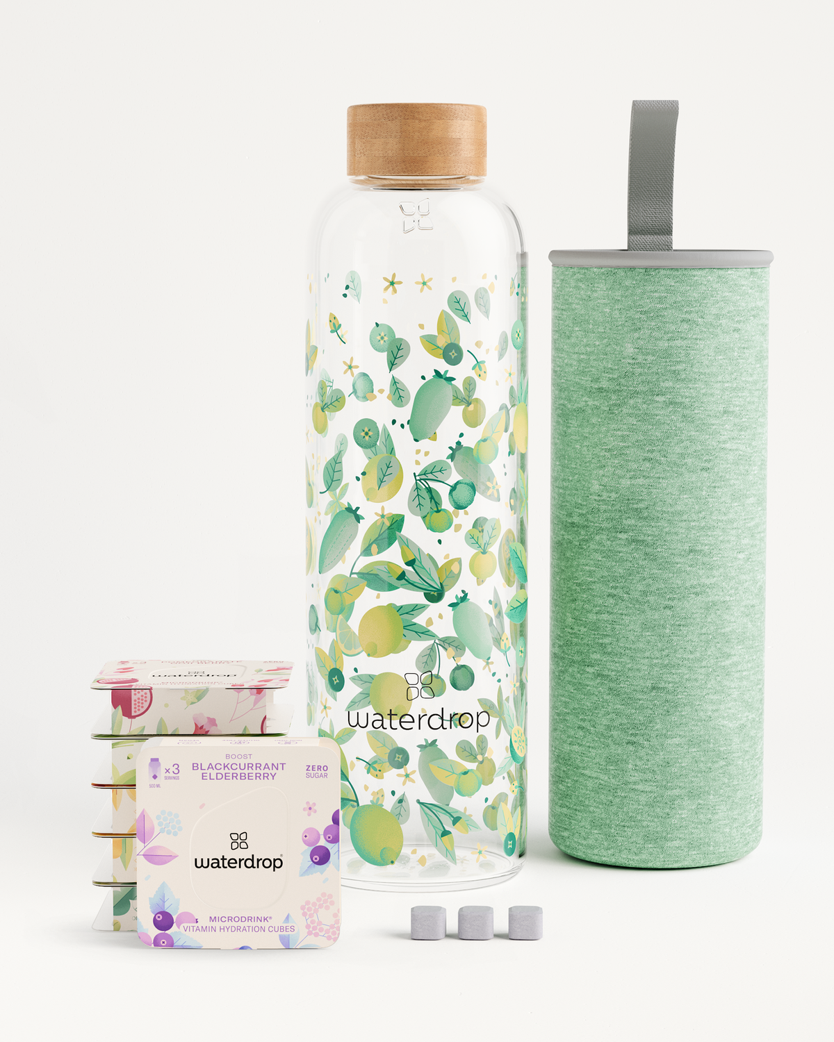 Starter Set Microdrink Glass with Borosilicate Glass Bottle and 6 Microdrink flavor packs in 3-packs, highlighting fruits and leaves design.