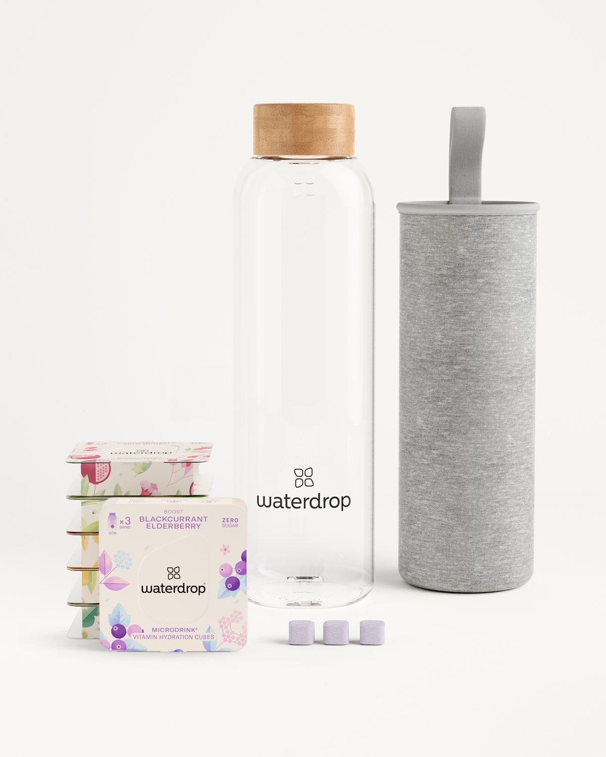 Starter Set Microdrink Glass: Includes a borosilicate glass bottle and six 3-packs of Microdrink flavors, shown with a container and packaging.