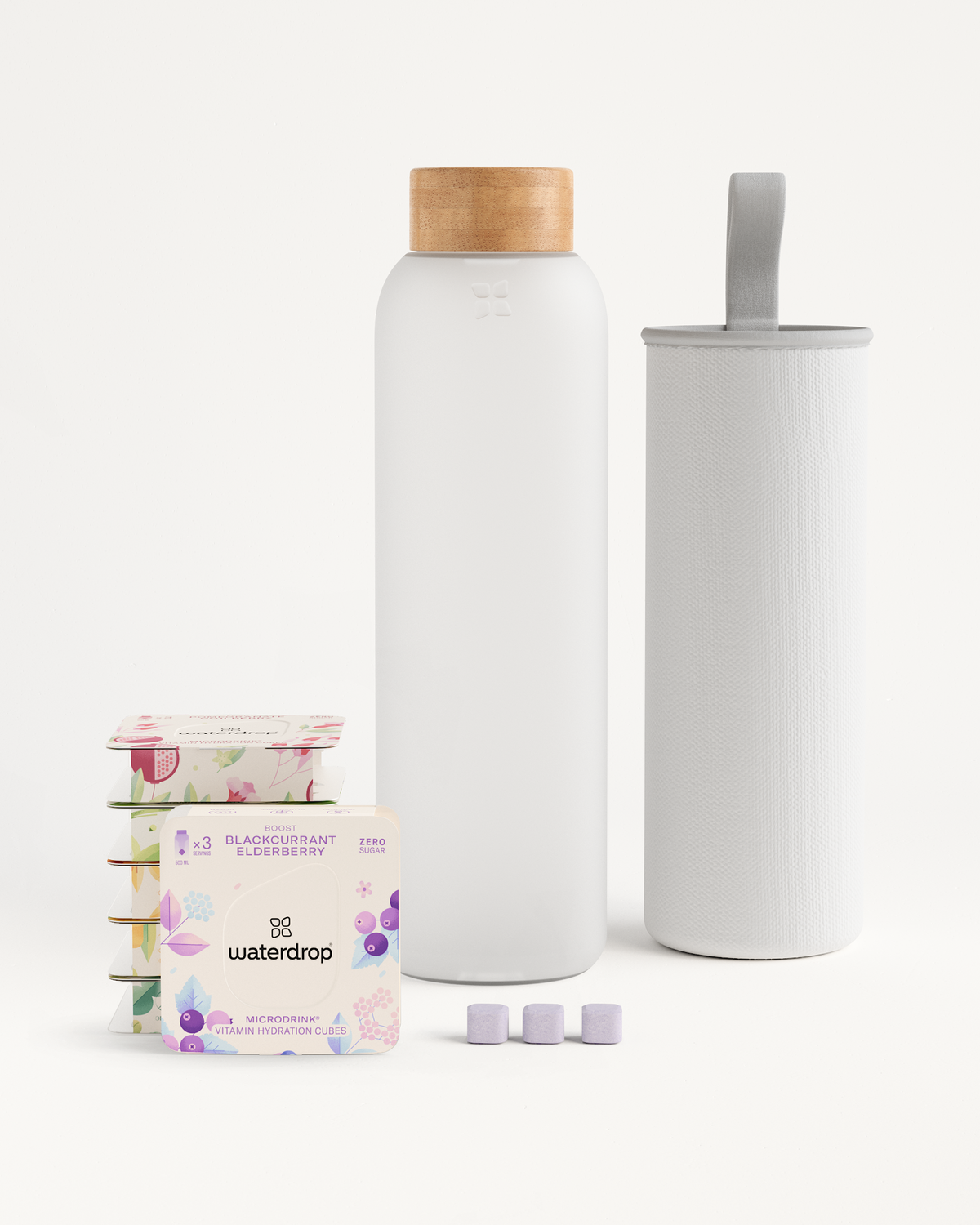 Starter Set Microdrink Glass featuring a Borosilicate Glass Bottle and multiple flavor packs displayed with packaging, showcasing waterdrop®’s hydration solutions.