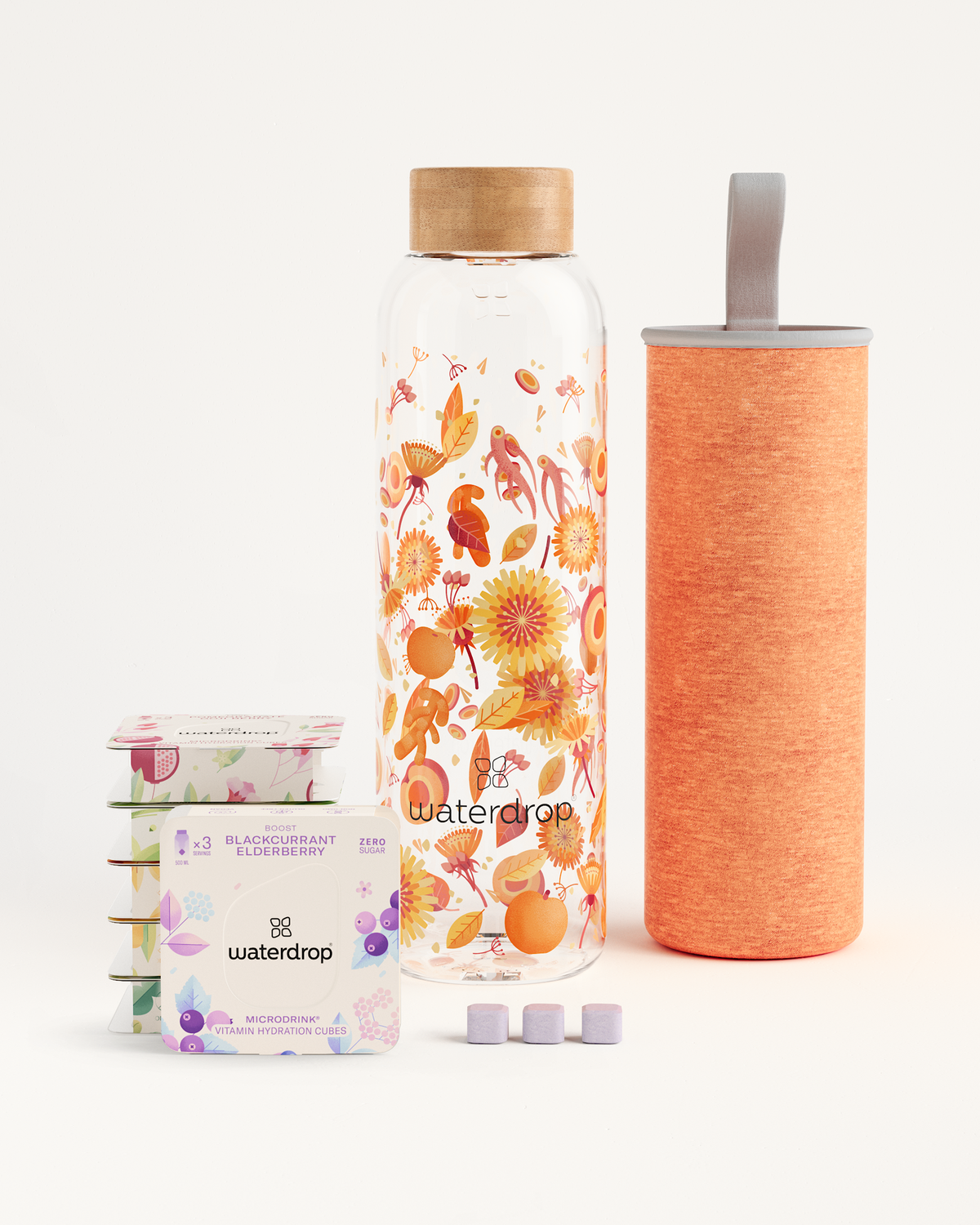 Starter Set Microdrink Glass: A water bottle and container alongside a box of elderberry flavoring, perfect for tasting six Microdrink flavors.