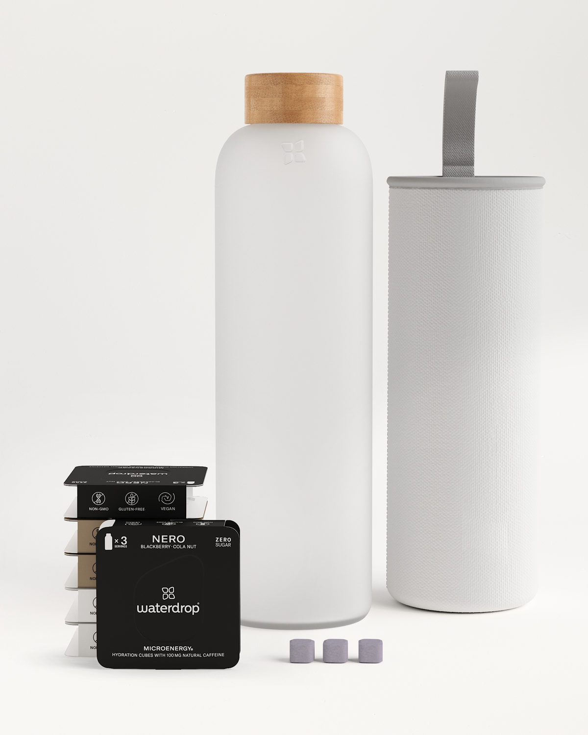 Starter Set Microenergy Glass with a white bottle, a filter, and black boxes. Contains 80-100mg caffeine per serving for an invigorating boost.